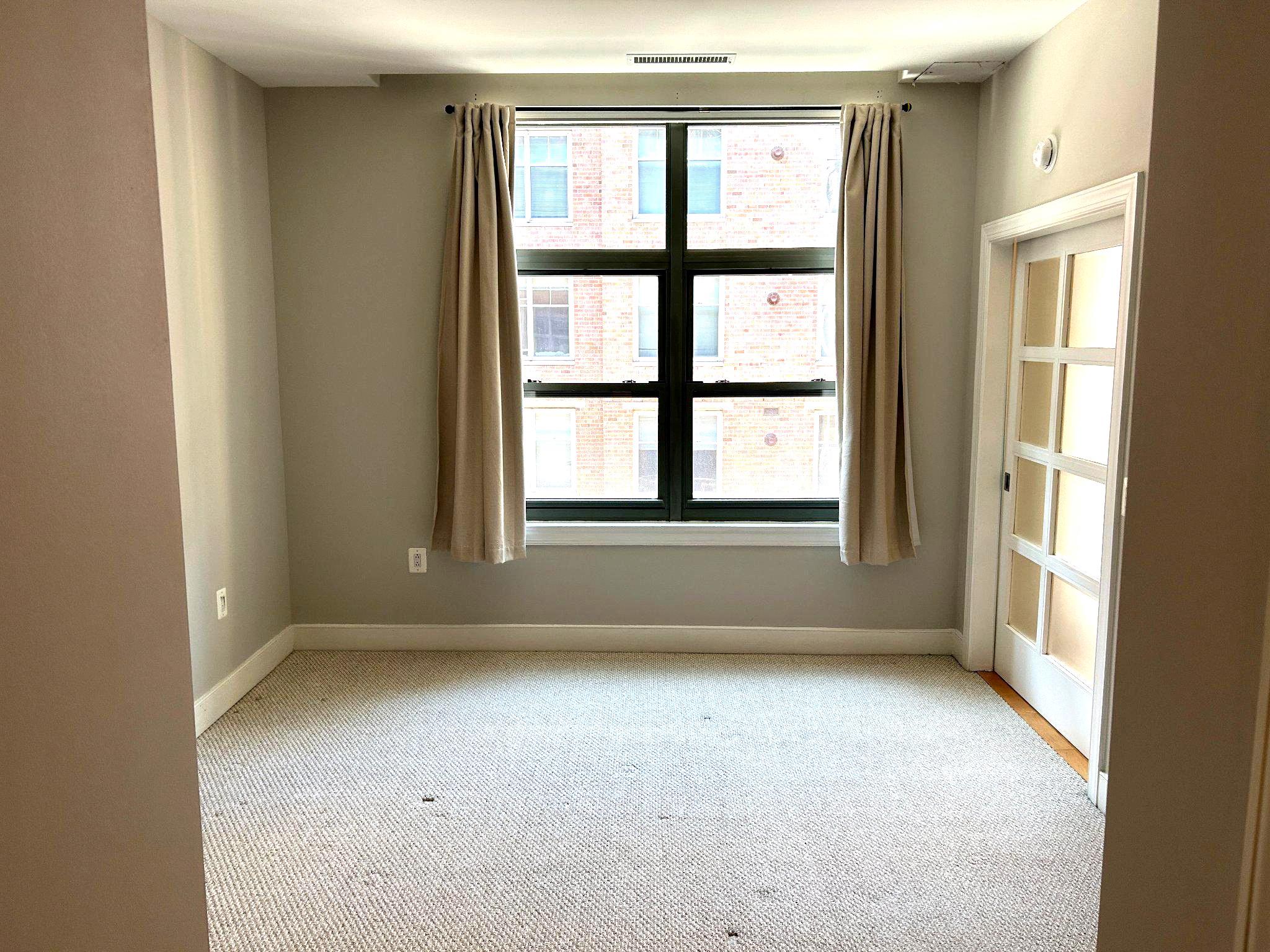 2425 L Street Northwest, Unit 421 Washington, DC 20037 - Photo 11 of 18 Bedroom with large windows