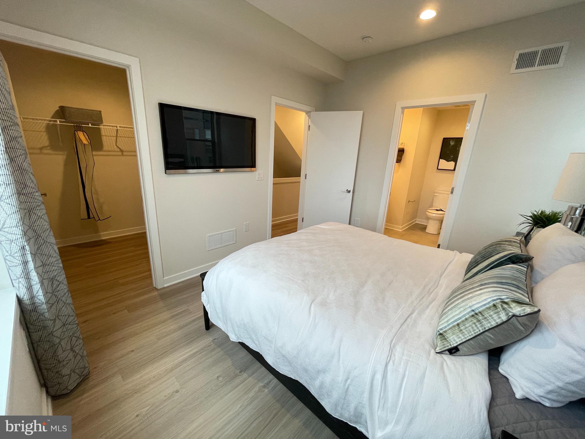 3125 Beachview Lane Philadelphia, PA 19125 - Photo 18 of 37 a bedroom with a bed and a flat screen tv