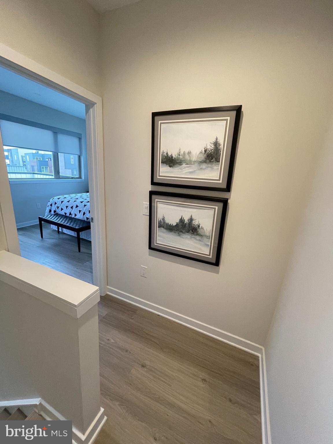 3125 Beachview Lane Philadelphia, PA 19125 - Photo 28 of 37 a view of a hallway with wooden floor and a bookshelf
