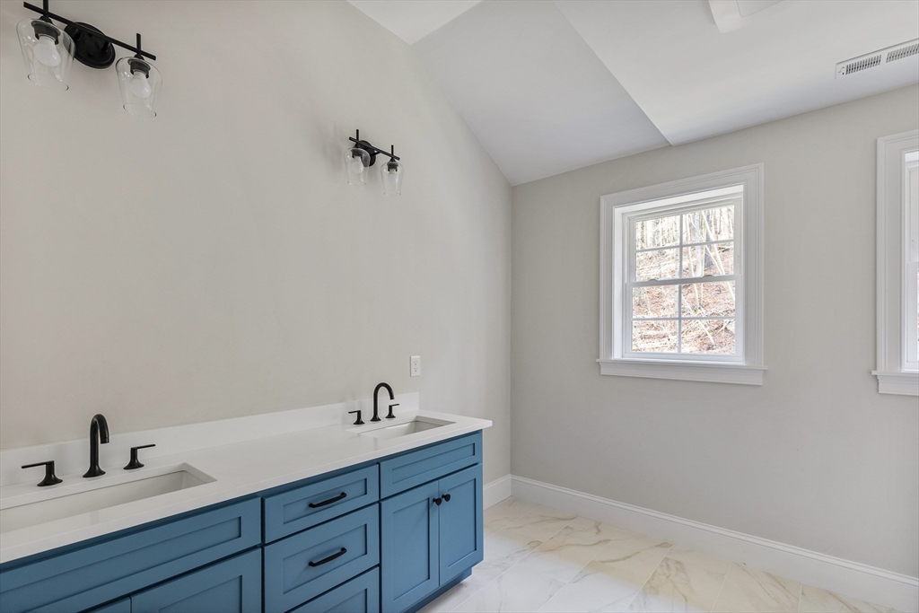 60 Wesson Street Grafton, MA 01536 - Photo 23 of 42 a bathroom with a sink and a window