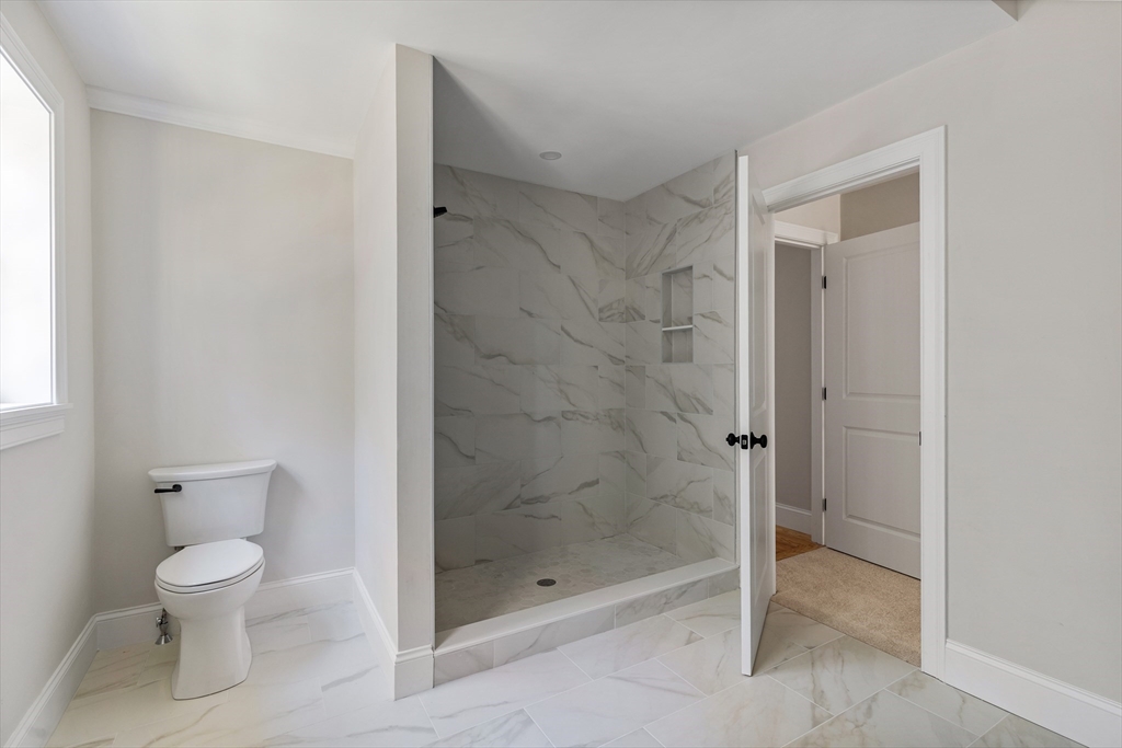 60 Wesson Street Grafton, MA 01536 - Photo 24 of 42 a bathroom with a shower and a toilet