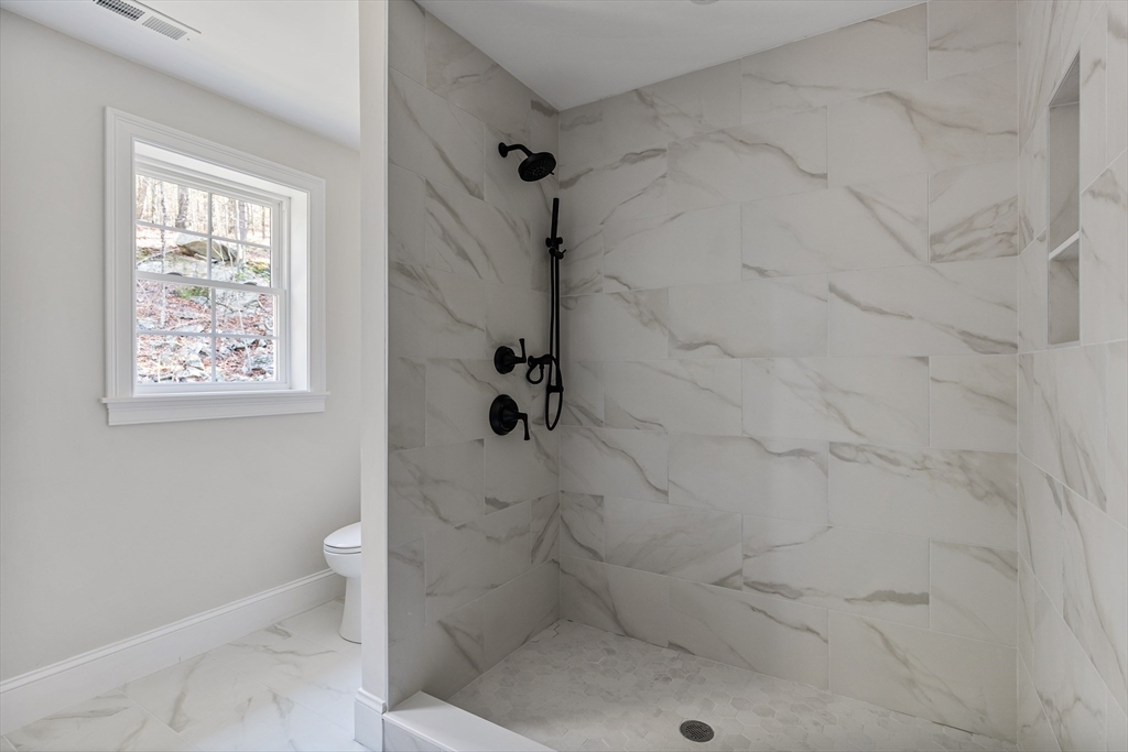 60 Wesson Street Grafton, MA 01536 - Photo 25 of 42 a bathroom with a toilet and a shower