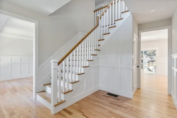 a view of entryway with wooden floor
