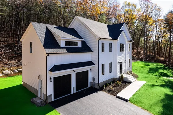 a aerial view of a house with a yard