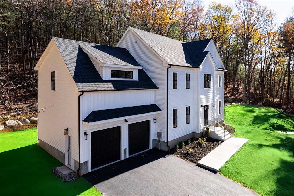 60 Wesson Street Grafton, MA 01536 - Photo 40 of 42 a aerial view of a house with a yard