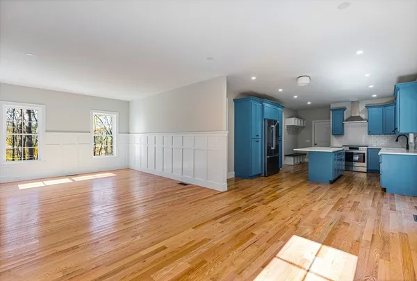 a view of kitchen with furniture and wooden floor