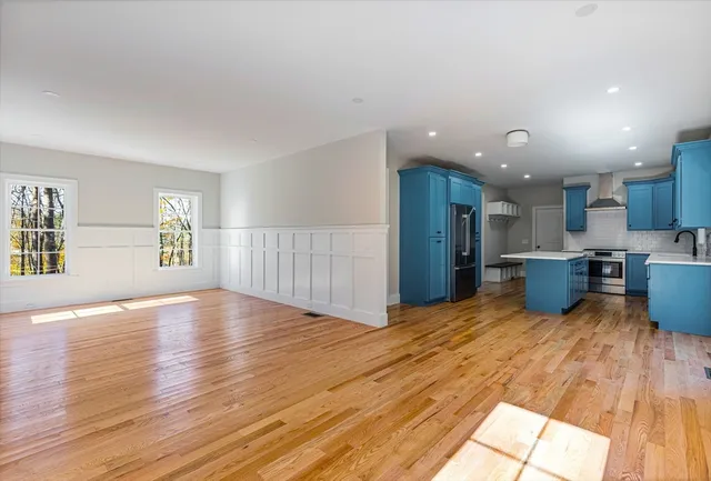 a view of kitchen with furniture and wooden floor
