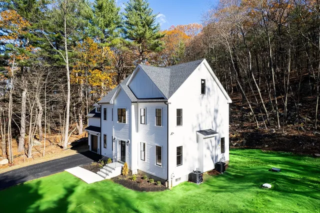 a view of house with backyard