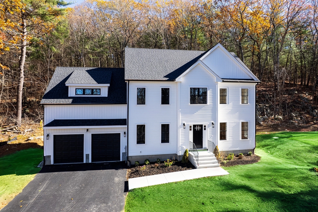 60 Wesson Street Grafton, MA 01536 - Photo 42 of 42 a front view of a house with a yard