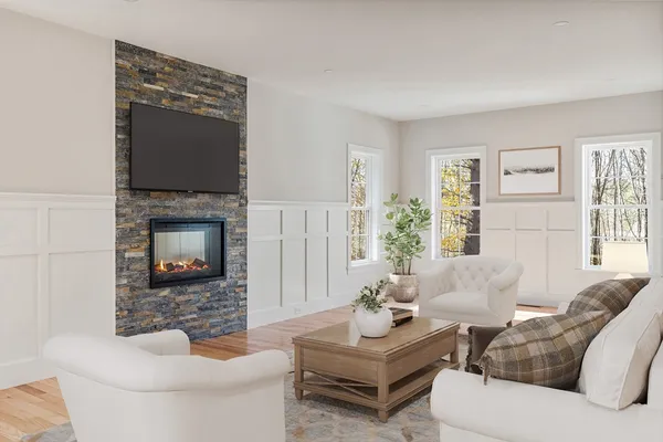 a living room with furniture and a fireplace