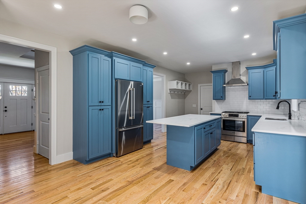 60 Wesson Street Grafton, MA 01536 - Photo 7 of 42 a kitchen with stainless steel appliances granite countertop a refrigerator stove and wooden cabinets