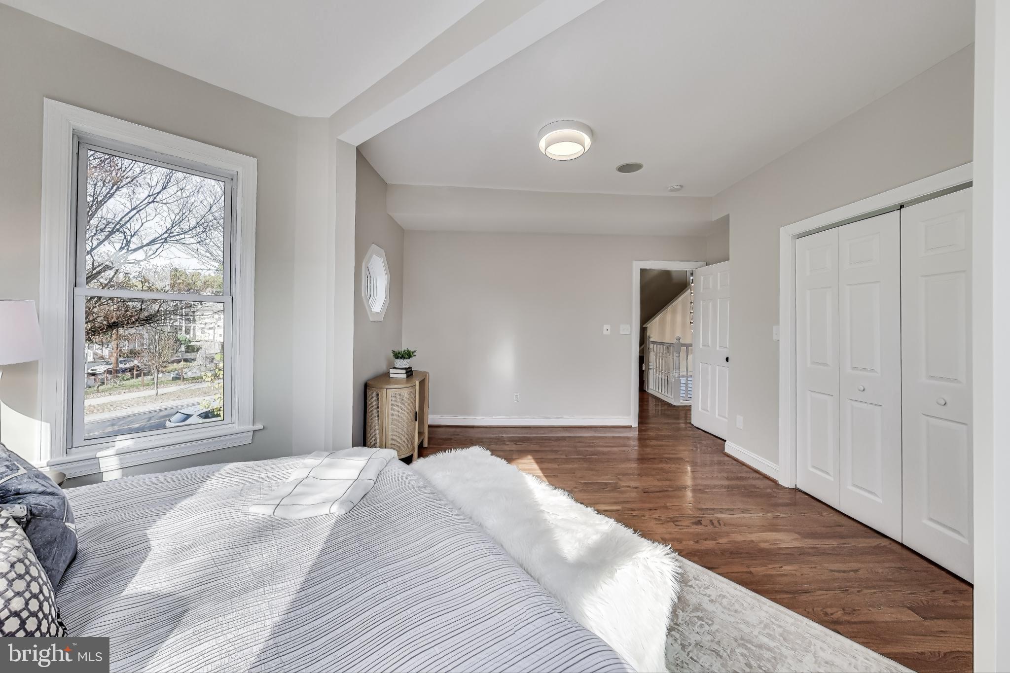 4301 Kansas Avenue Northwest Washington, DC 20011 - Photo 32 of 80 a bedroom with a bed and a window