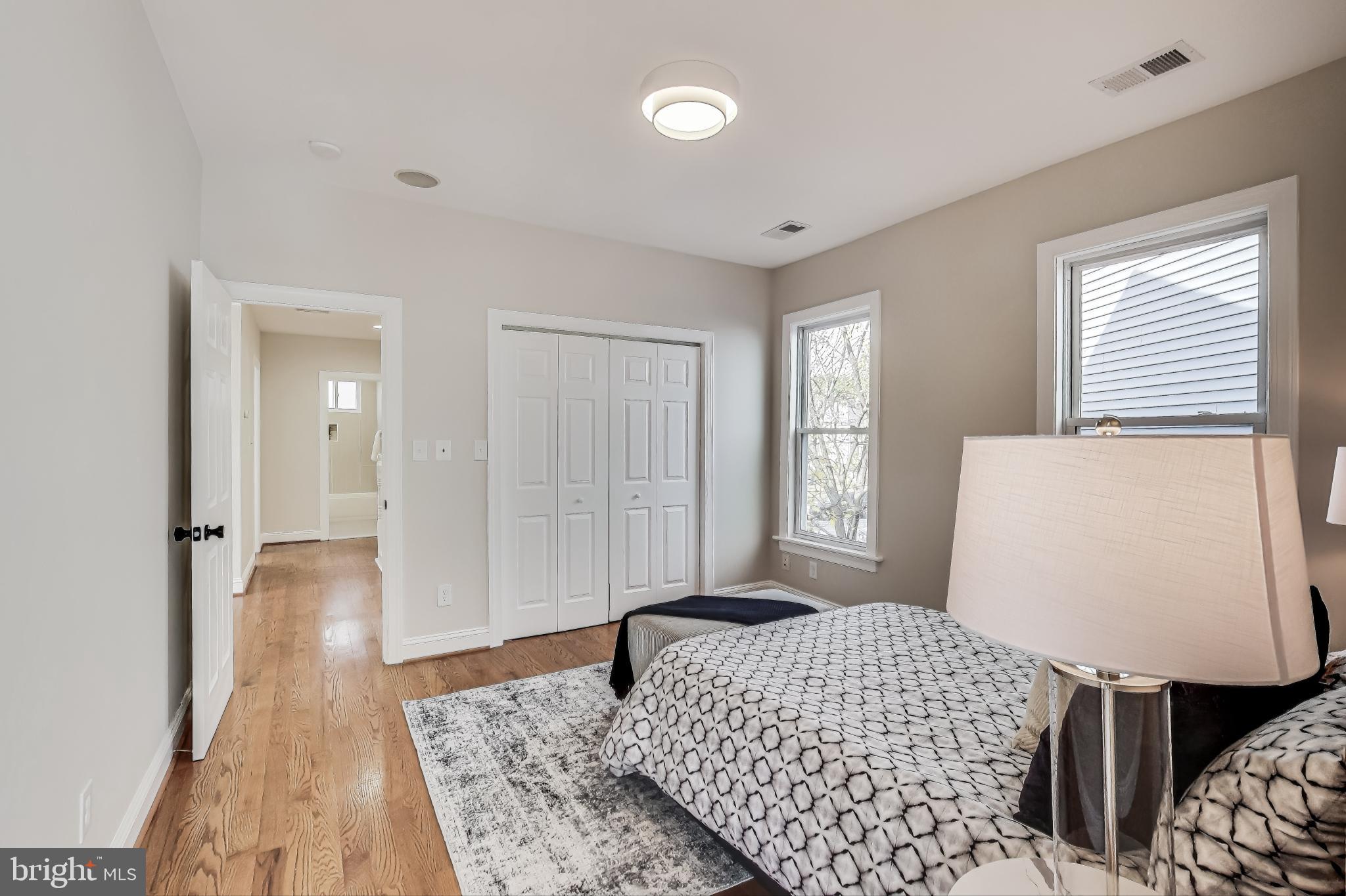 4301 Kansas Avenue Northwest Washington, DC 20011 - Photo 37 of 80 a bedroom with a bed and a window