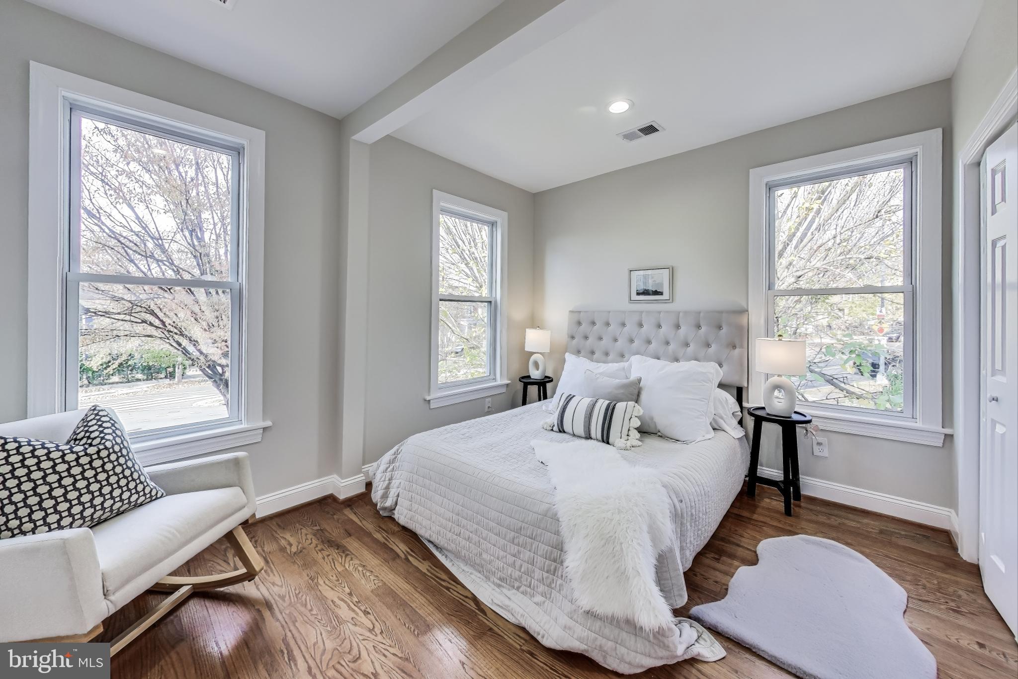 4301 Kansas Avenue Northwest Washington, DC 20011 - Photo 40 of 80 a bedroom with a bed and a large window