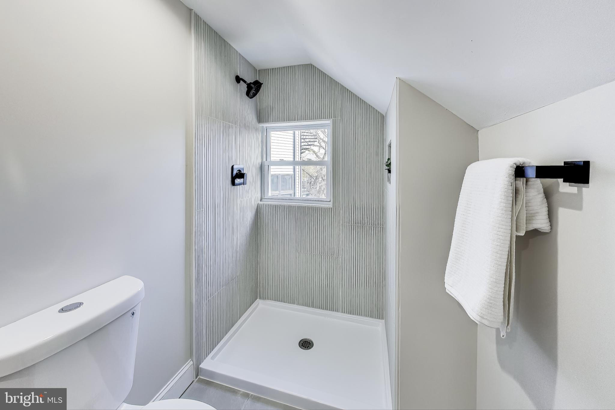 4301 Kansas Avenue Northwest Washington, DC 20011 - Photo 52 of 80 a bathroom with a tub and a shower