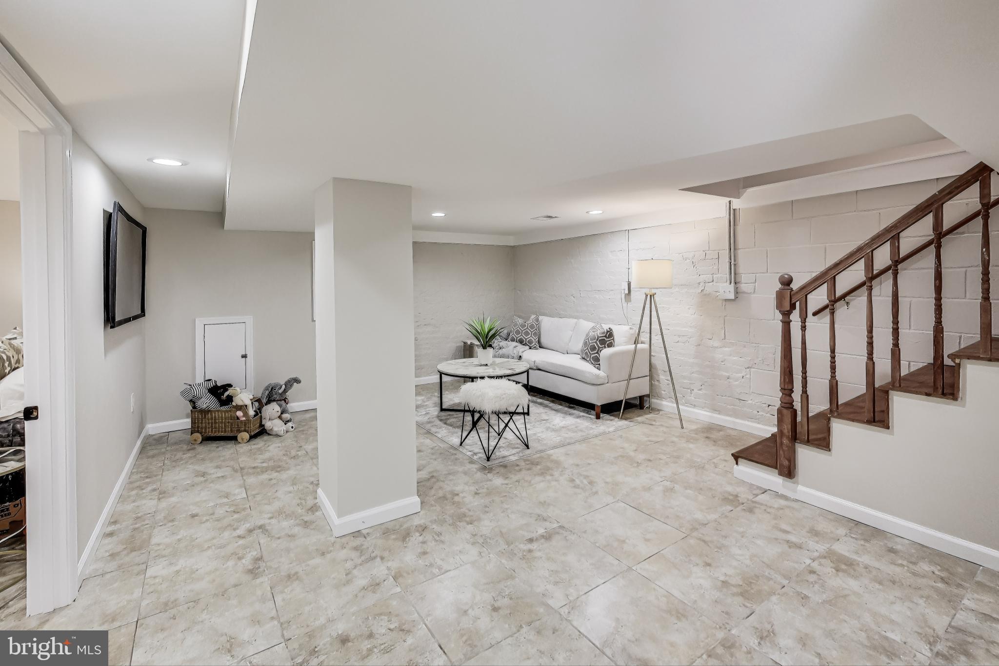 4301 Kansas Avenue Northwest Washington, DC 20011 - Photo 57 of 80 a living room with furniture and a rug