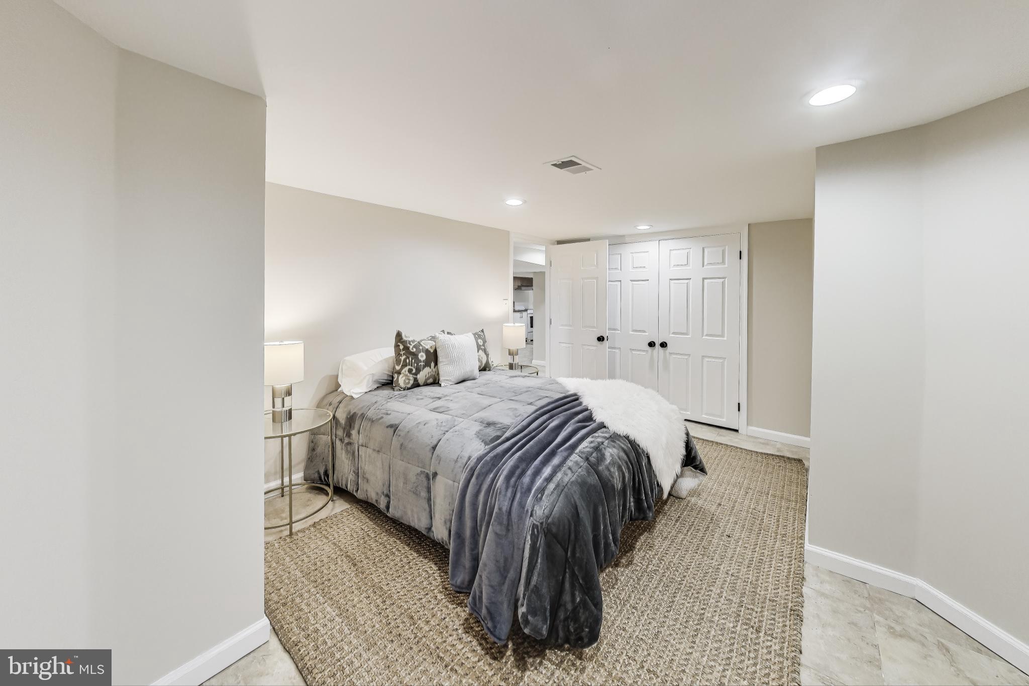 4301 Kansas Avenue Northwest Washington, DC 20011 - Photo 69 of 80 a bed room with a bed and a night stand