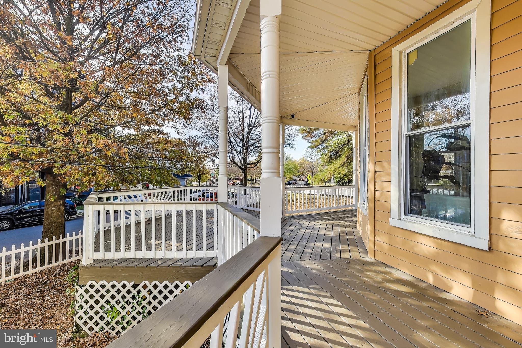 4301 Kansas Avenue Northwest Washington, DC 20011 - Photo 10 of 80 a view of a brick house with a wooden bench