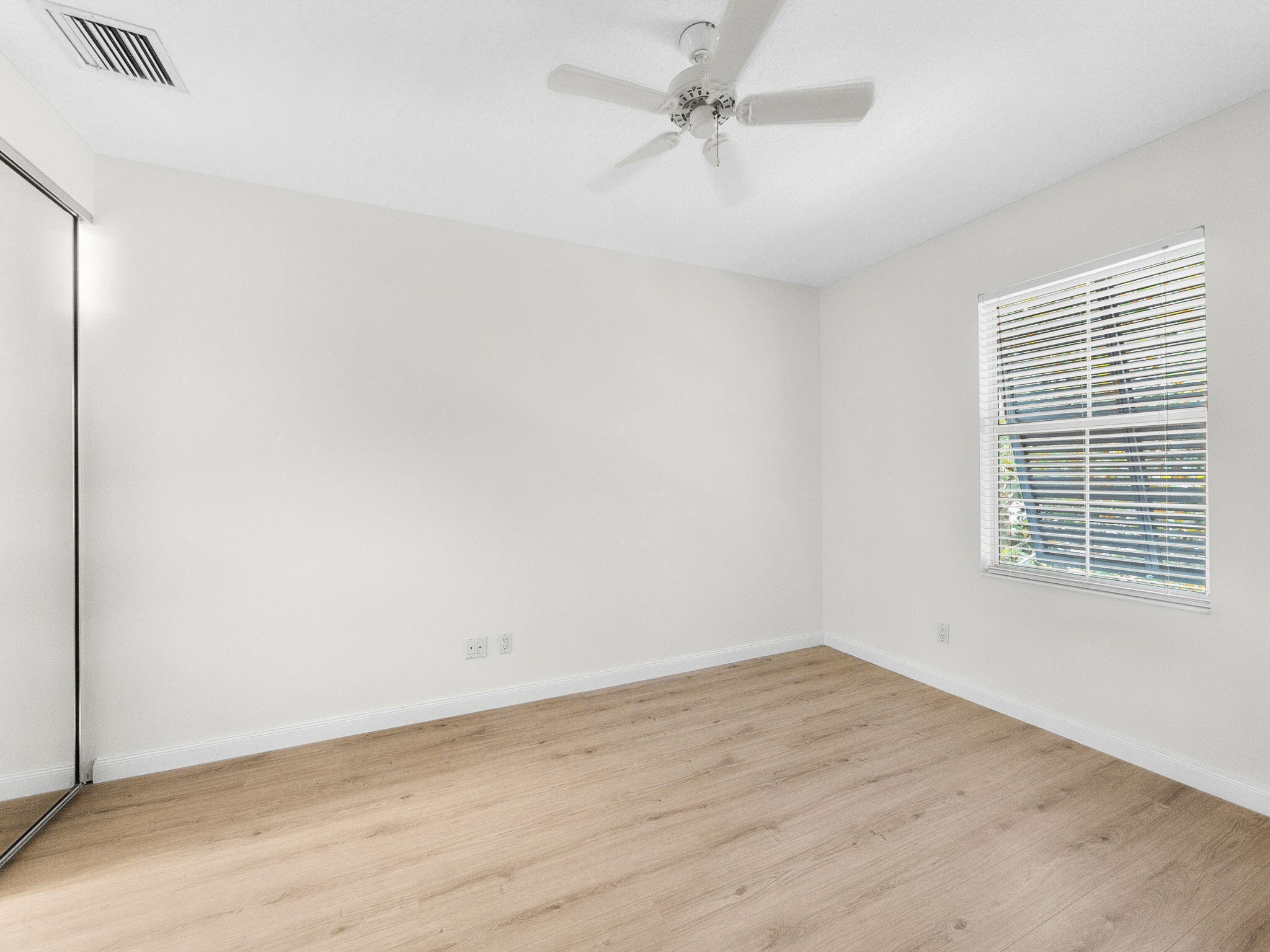 3119 East Community Drive Jupiter, FL 33458 - Photo 12 of 24 a view of an empty room with a window