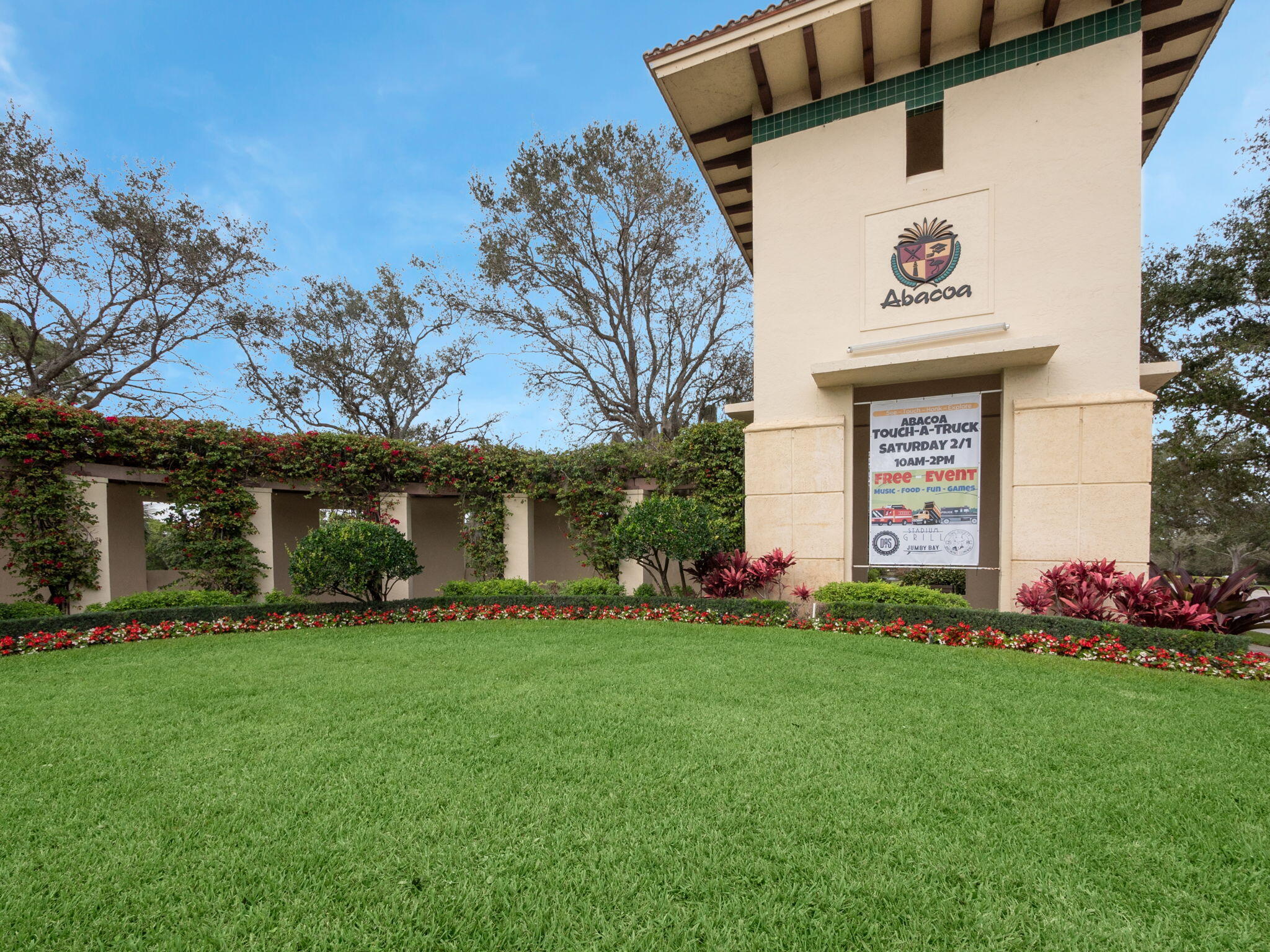 3119 East Community Drive Jupiter, FL 33458 - Photo 20 of 24 a front view of a house with a garden