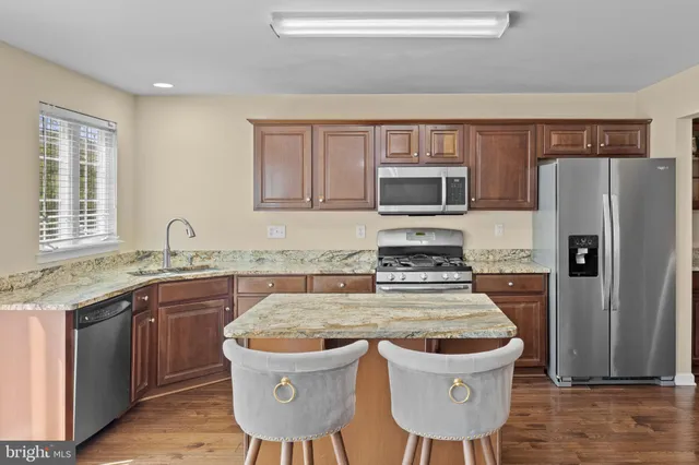 a view of a chairs and table on the wooden floor