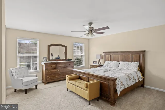 a bathroom with a granite countertop sink a vanity and a mirror