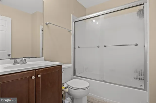 a view of a house with many windows and plants