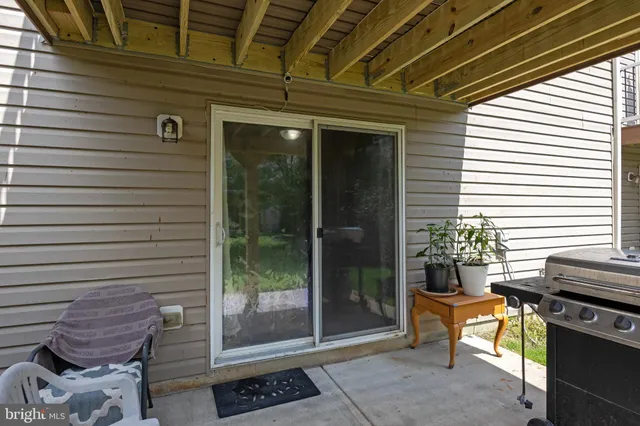 an aerial view of multiple houses with yard