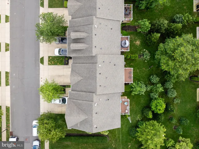 a car parked in front of a brick house