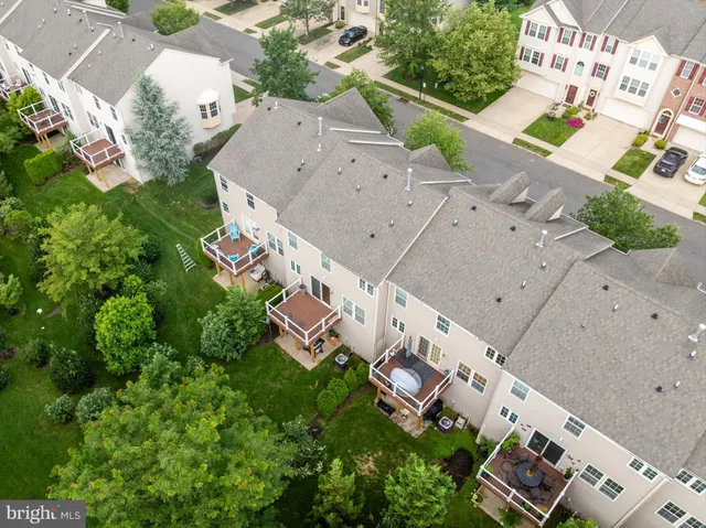 an aerial view of a house with yard swimming pool and outdoor seating