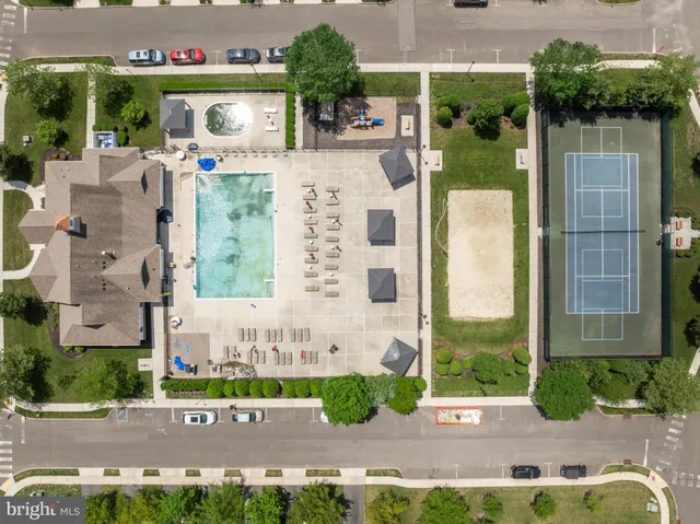 a view of a patio with a table and chairs and potted plants