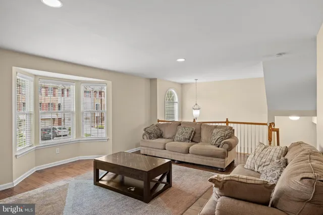 a kitchen with stainless steel appliances granite countertop a sink stove microwave and refrigerator