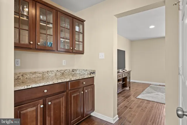 a kitchen with a stove sink and refrigerator