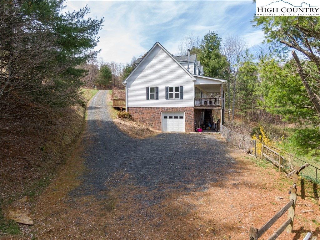 449 Meadow Ridge Drive Jefferson, NC 28640 - Photo 5 of 37 a view of house and outdoor space