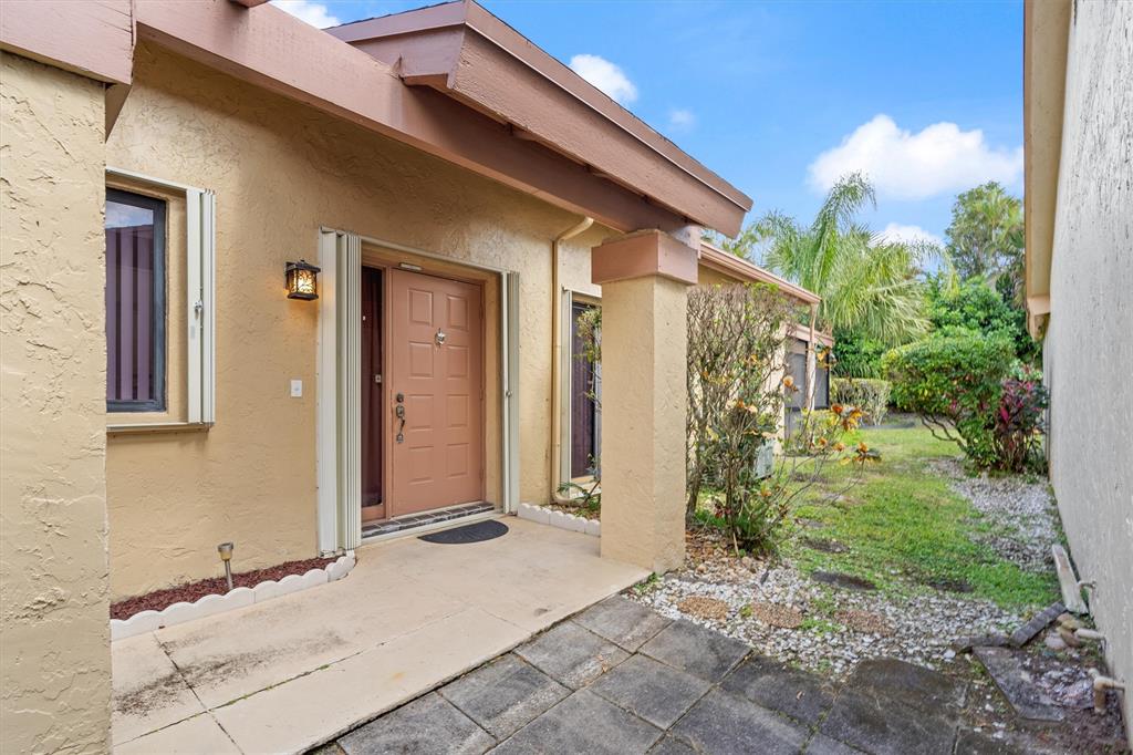 4342 Acacia Circle Coconut Creek, FL 33066 - Photo 20 of 20 a front view of a house with a yard