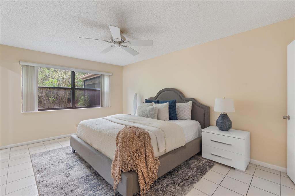 4342 Acacia Circle Coconut Creek, FL 33066 - Photo 4 of 20 a bed room with a bed and a window