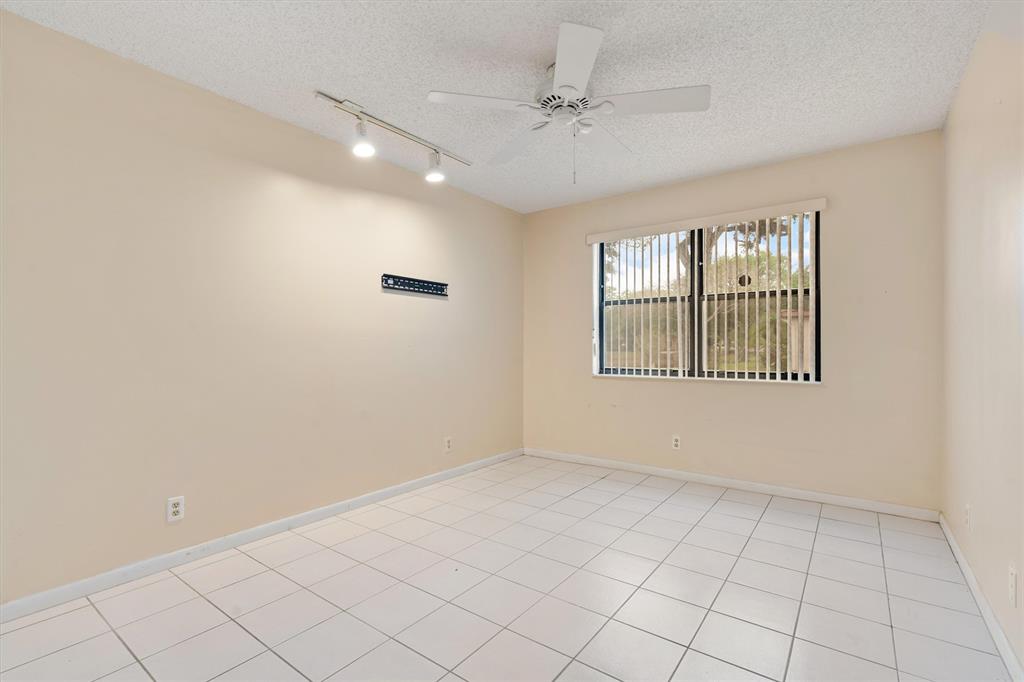 4342 Acacia Circle Coconut Creek, FL 33066 - Photo 7 of 20 a view of an empty room with a window
