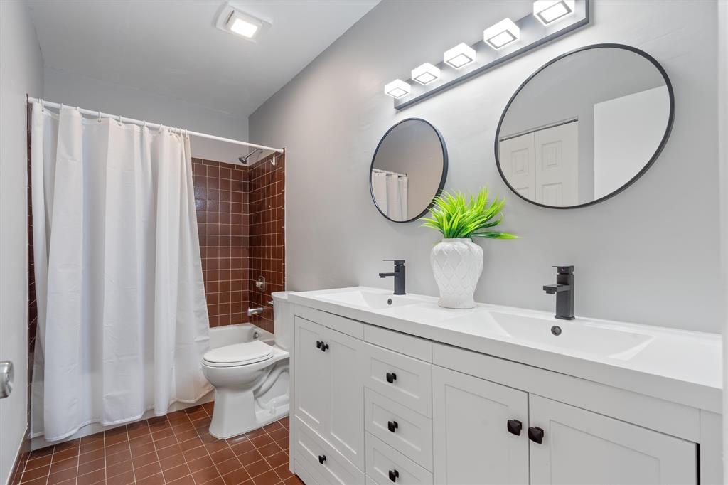 4342 Acacia Circle Coconut Creek, FL 33066 - Photo 8 of 20 a bathroom with a toilet a sink and a mirror