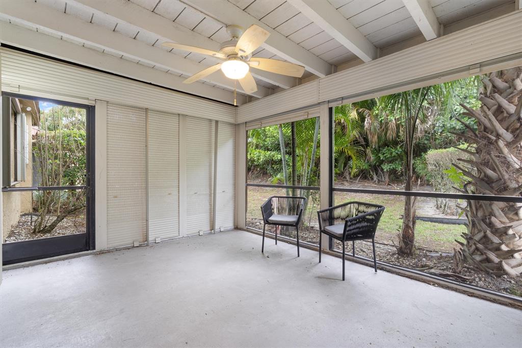 4342 Acacia Circle Coconut Creek, FL 33066 - Photo 9 of 20 a living room with furniture and a floor to ceiling window