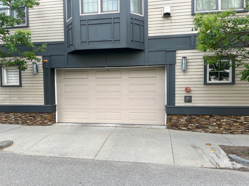 191 K Street, Unit PARKING 7 Boston, MA 02127 - Photo 2 of 2 a front view of a house with a garage