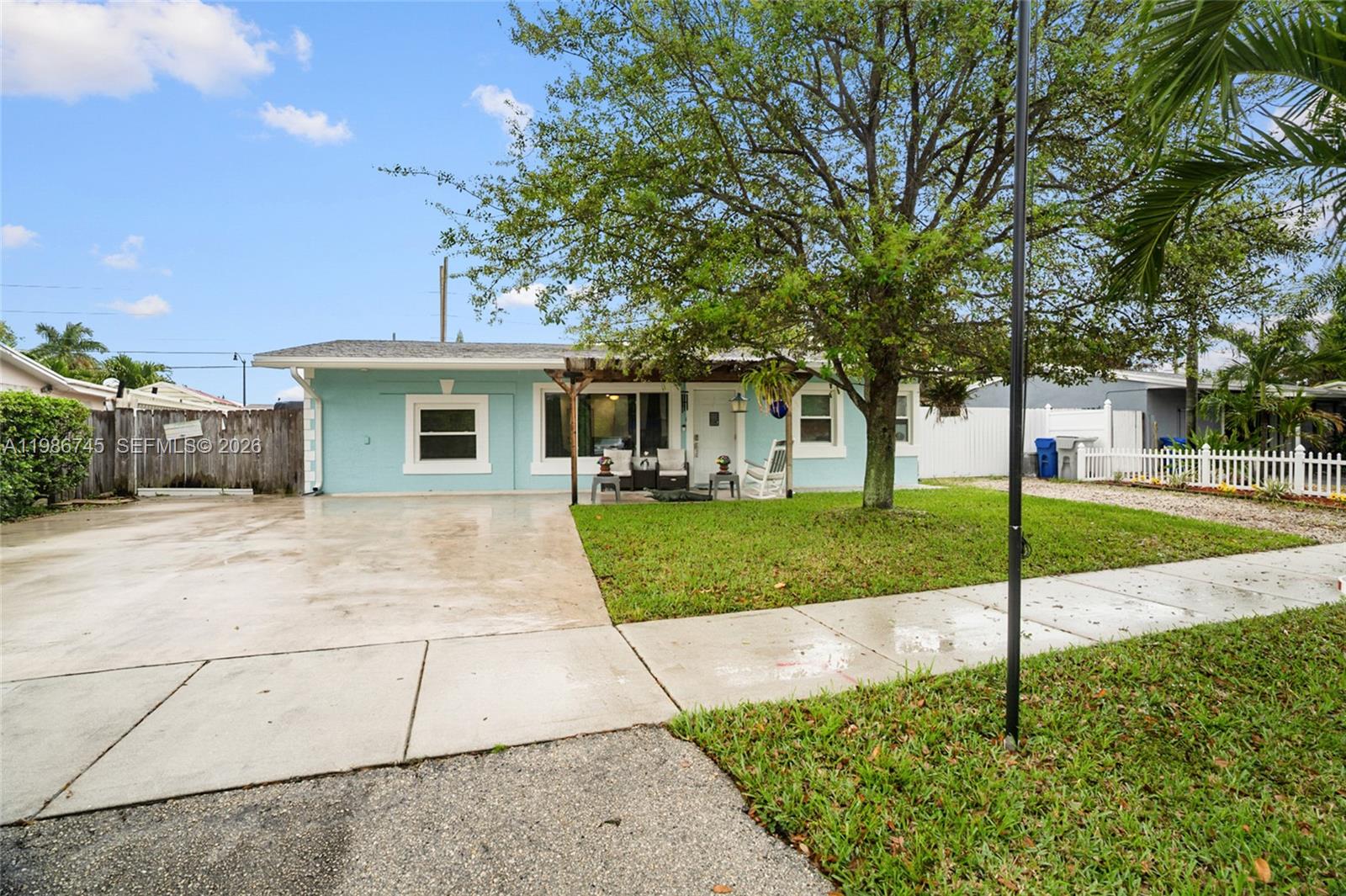 2810 Northeast 11th Terrace Pompano Beach, FL 33064 - Photo 1 of 33 a house view with a outdoor space