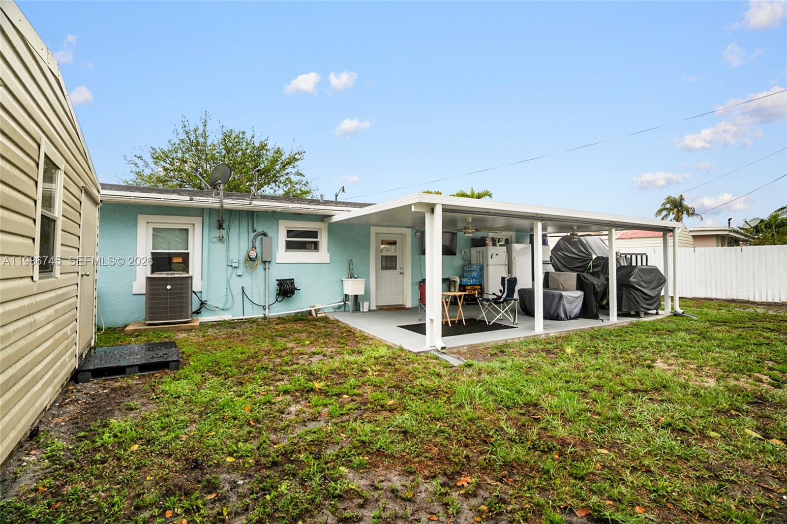 2810 Northeast 11th Terrace Pompano Beach, FL 33064 - Photo 19 of 33 a view of a house with a garden