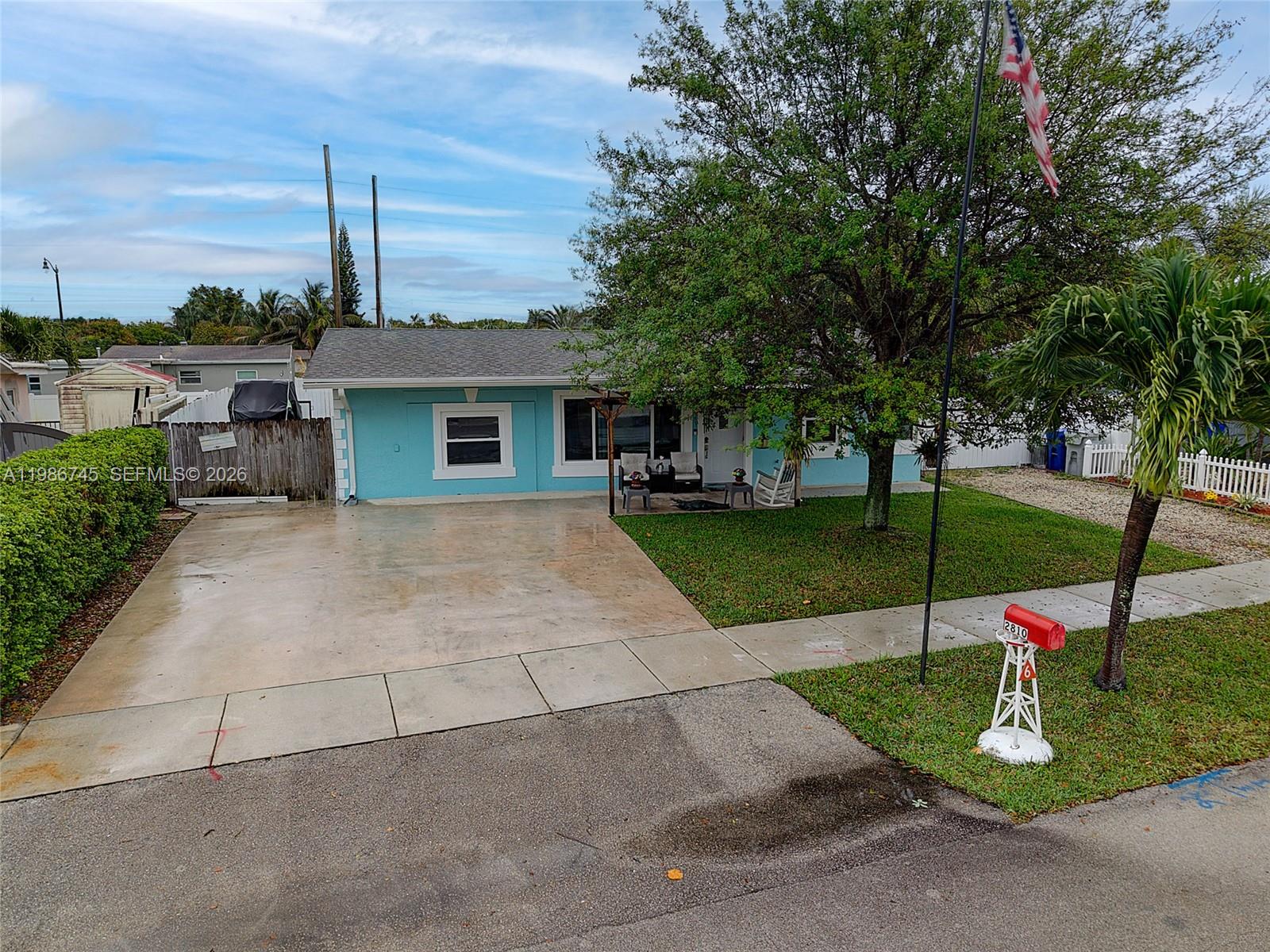 2810 Northeast 11th Terrace Pompano Beach, FL 33064 - Photo 24 of 33 a view of a house with a yard