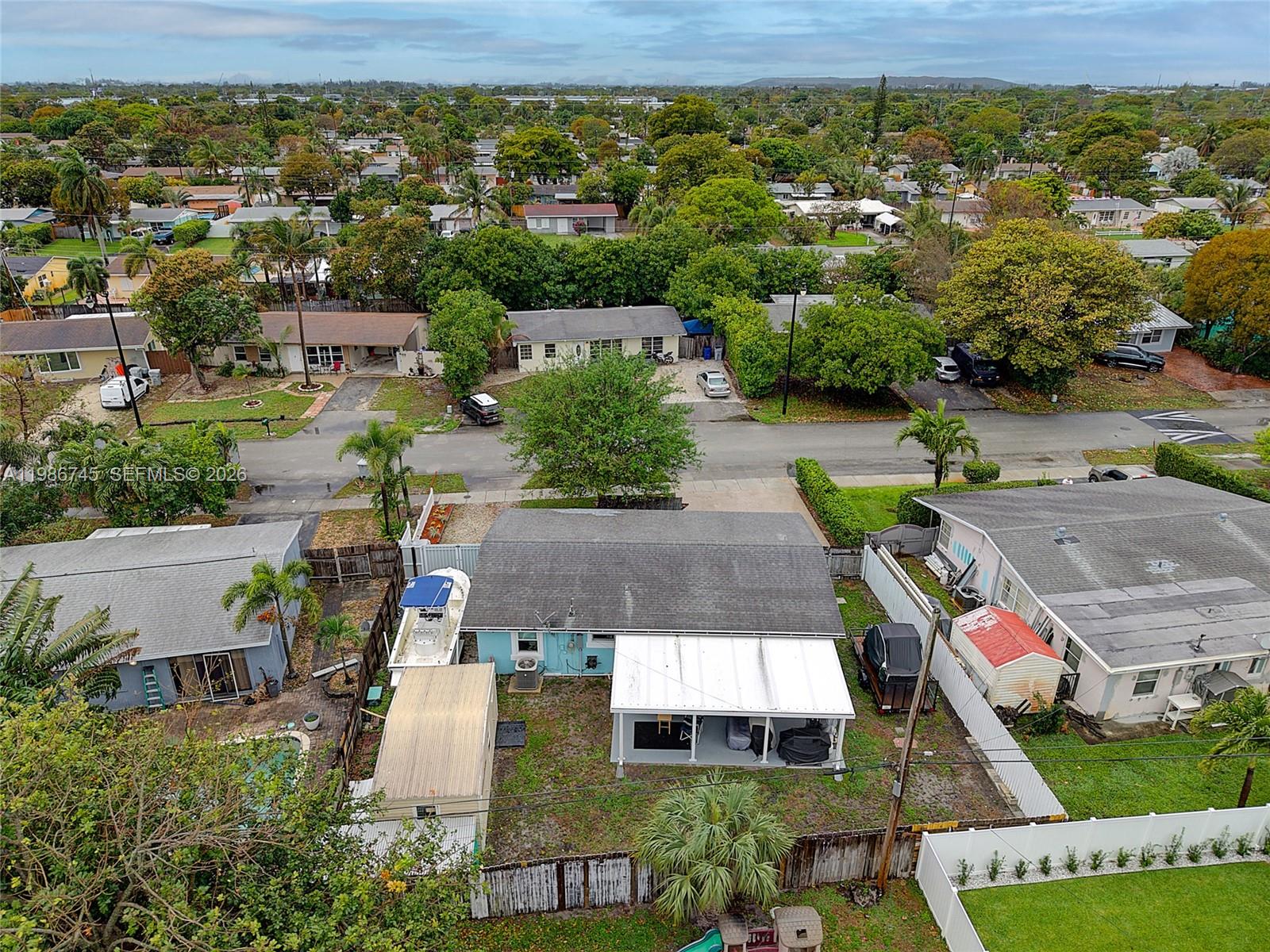 2810 Northeast 11th Terrace Pompano Beach, FL 33064 - Photo 26 of 33 an aerial view of a house with a yard