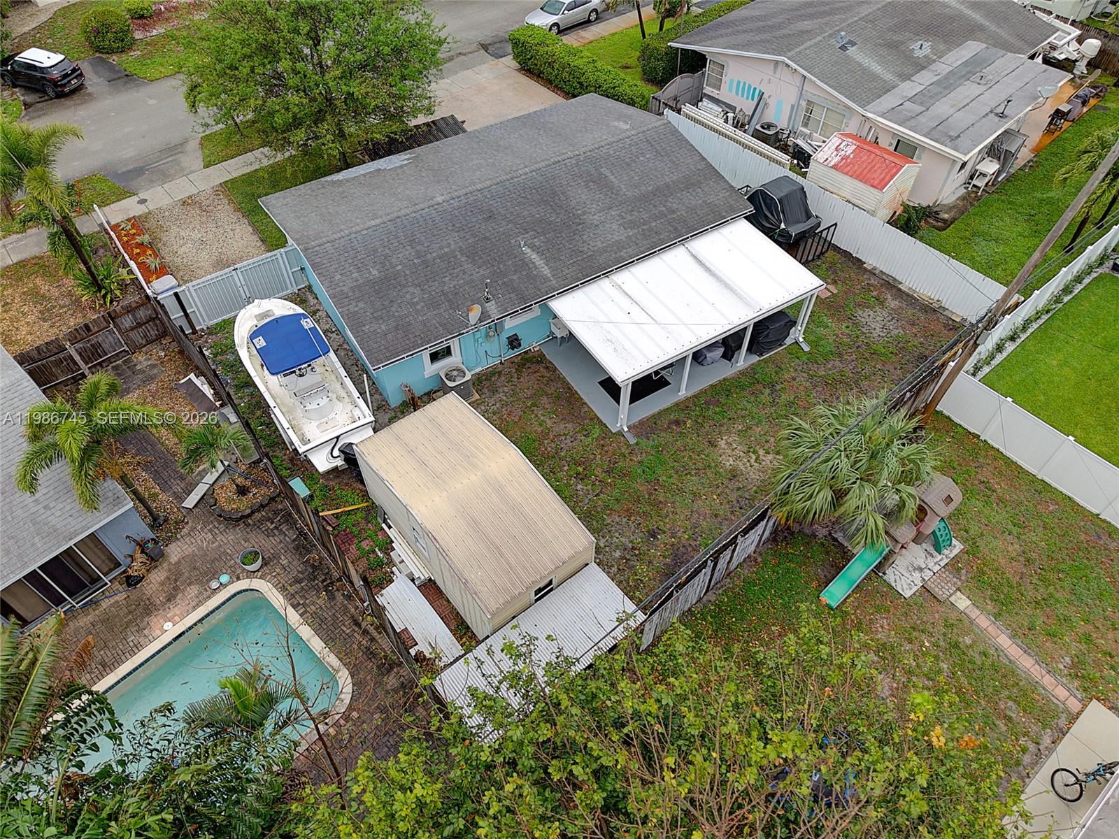 2810 Northeast 11th Terrace Pompano Beach, FL 33064 - Photo 29 of 33 an aerial view of a house with a yard