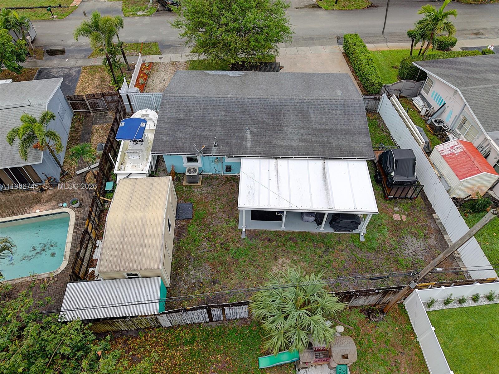 2810 Northeast 11th Terrace Pompano Beach, FL 33064 - Photo 30 of 33 an aerial view of a house with a yard