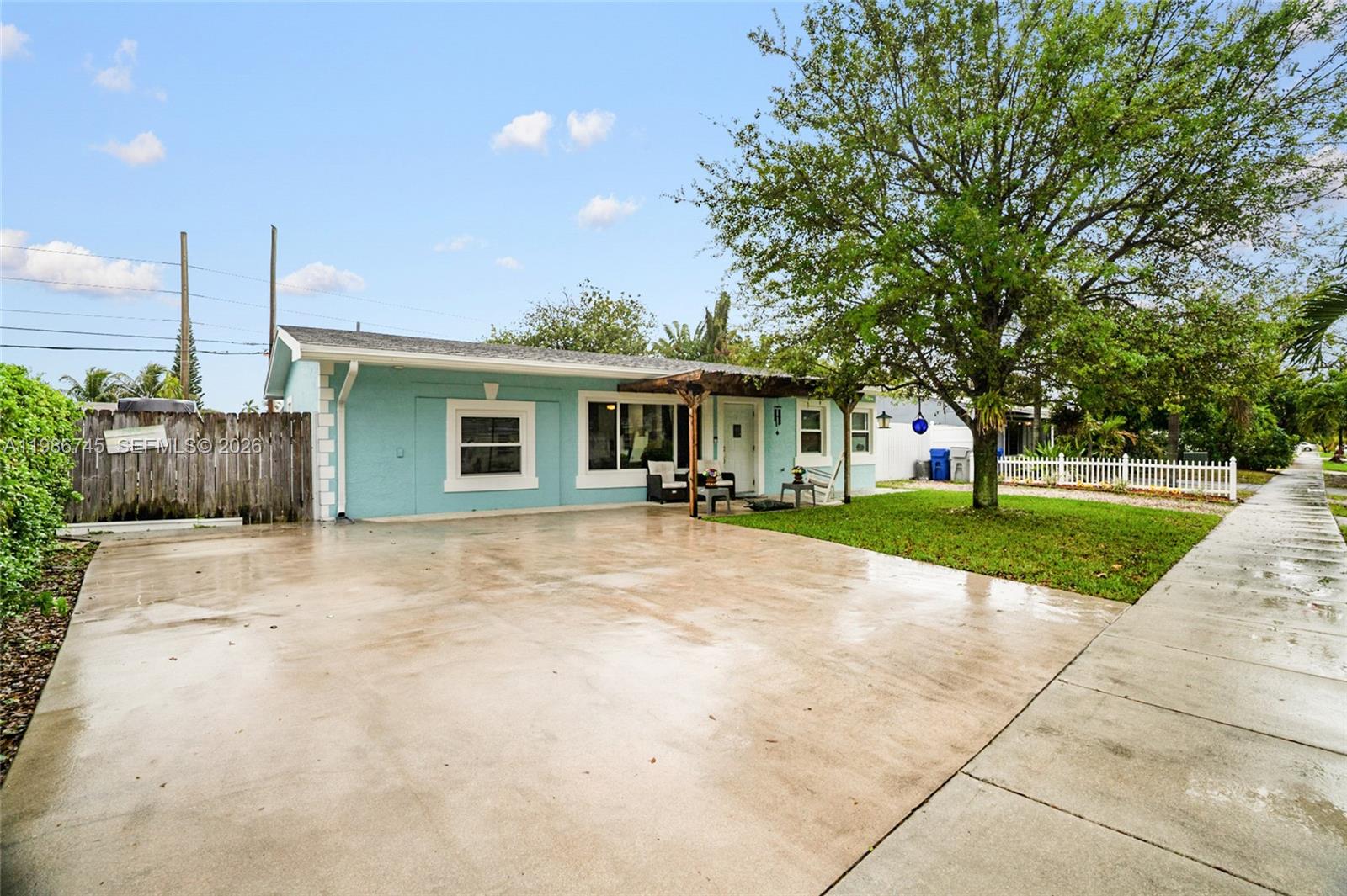2810 Northeast 11th Terrace Pompano Beach, FL 33064 - Photo 31 of 33 a view of a house with a yard