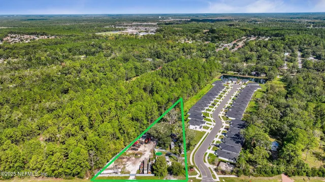 a view of a city with lush green forest