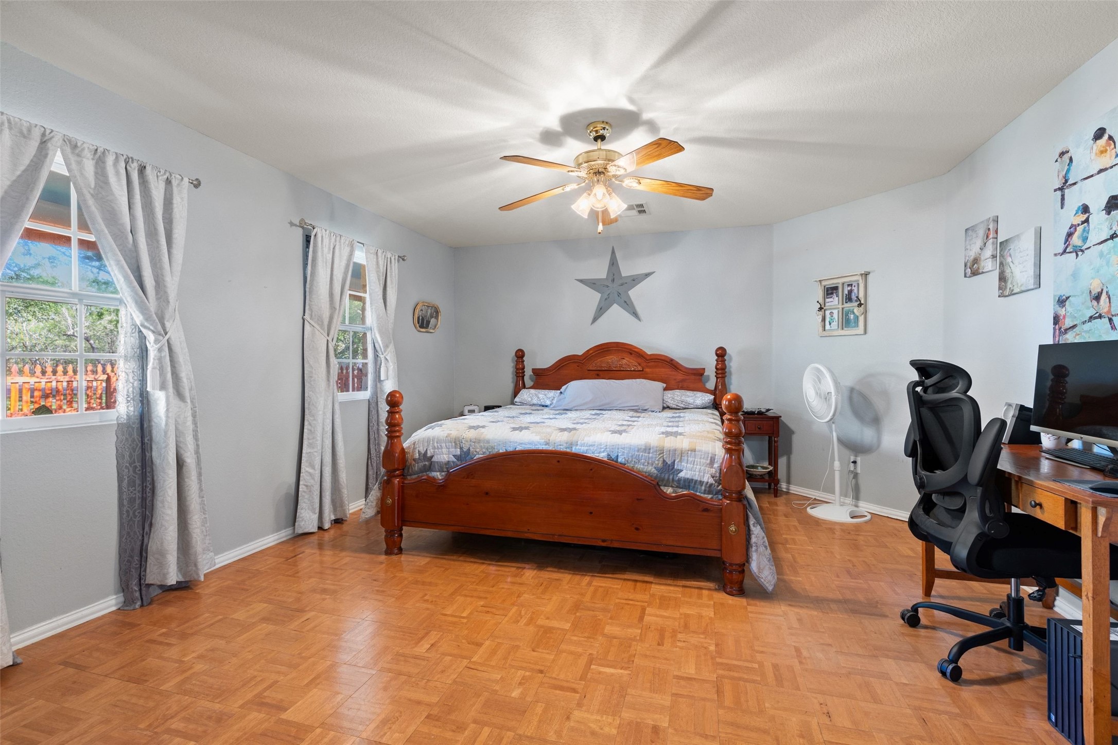 399 Upper Elgin River Road Elgin, TX 78621 - Photo 17 of 39 Primary bedroom with parquet floors, and ceiling fan