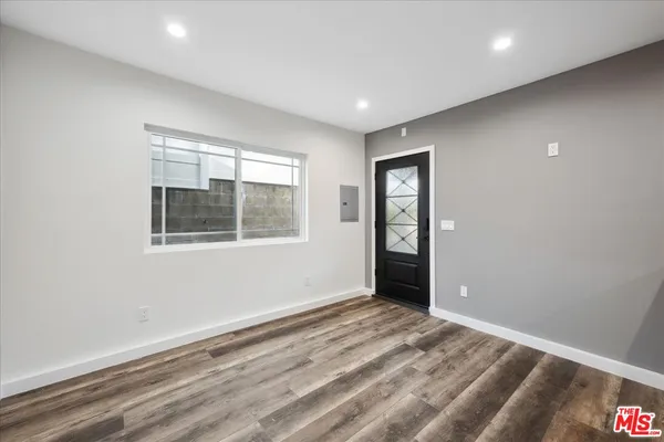 a view of an empty room with a window